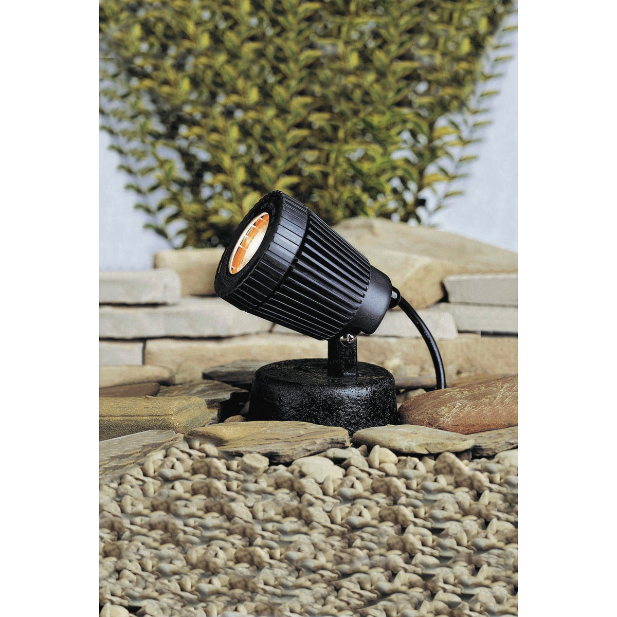 Black outdoor spot and flood accent light with cylindrical head on ground stake