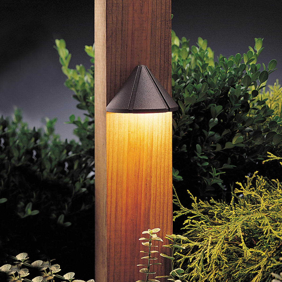 Textured bronze deck light with dark top and frosted cylindrical lens