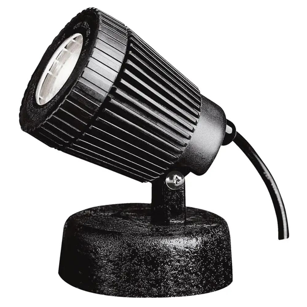 Black spotlight and floodlight fixture with ribbed housing, round glass lens, short stake