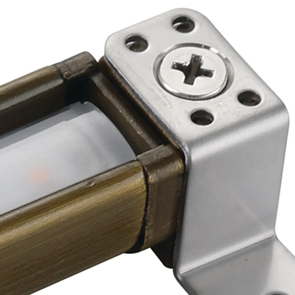 Close-up of brass hardscape LED end cap and screw mount plate