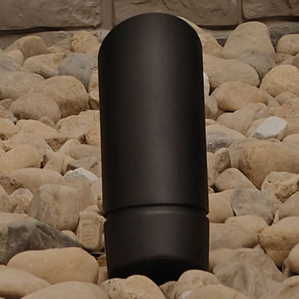 Close-up of black cylindrical landscape LED accent light with base collar