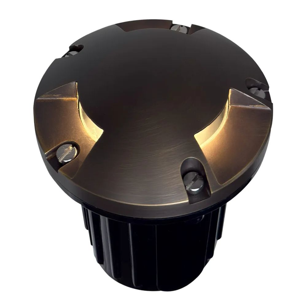 LED well light showing warm light glow from the brass-topped tri-directional opening
