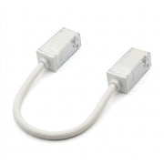 Flexible tape-to-tape connector with two rectangular housings and white connecting cable