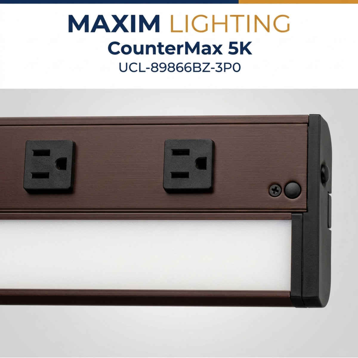Bronze undercabinet LED light bar close-up with two outlets and a circular control button.