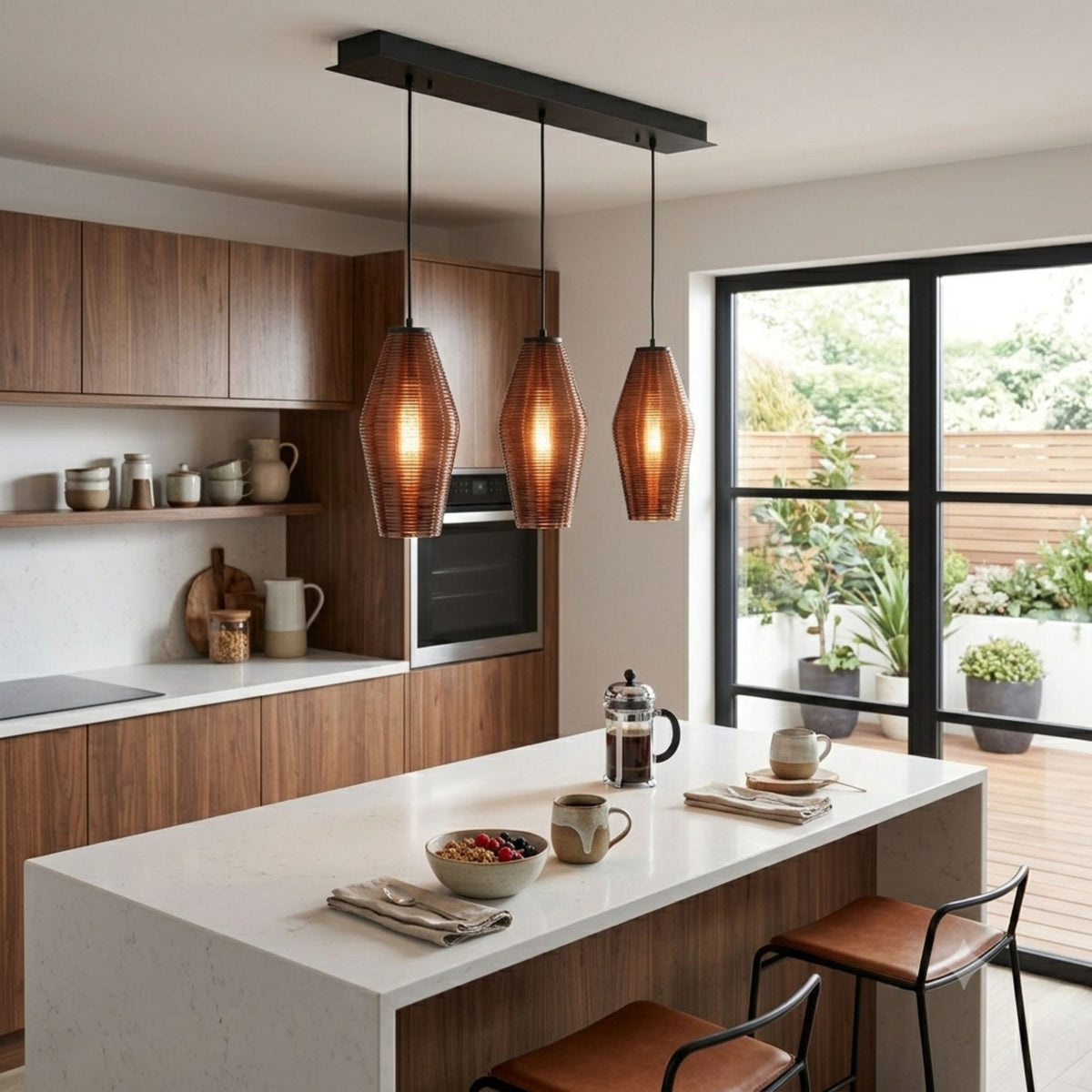 Three-light linear pendant with black bar and ribbed amber glass shades