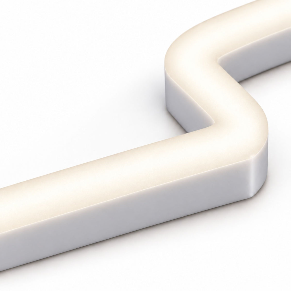 Close-up of white top-bend LED neon strip corner with smooth bend and low-profile housing.