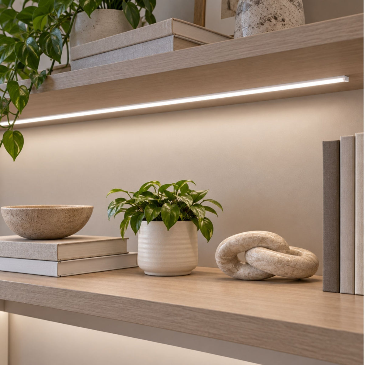 Clear open PC mounting channel under shelf, emitting warm linear light for LEDs