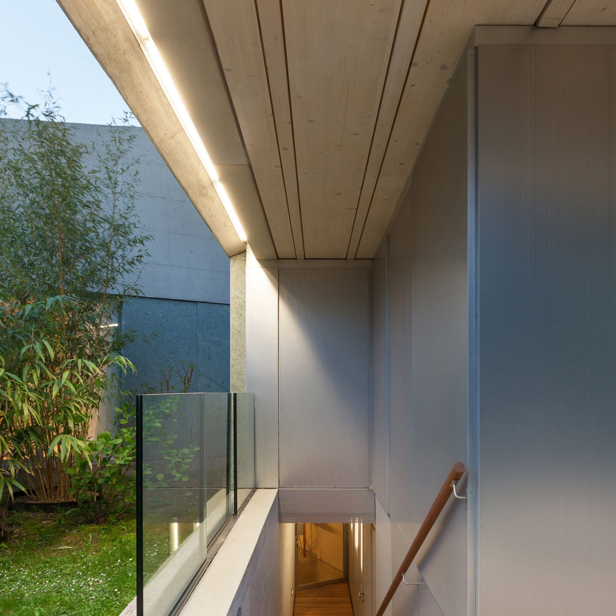 Outdoor LED mounting channel under eave with continuous warm light line
