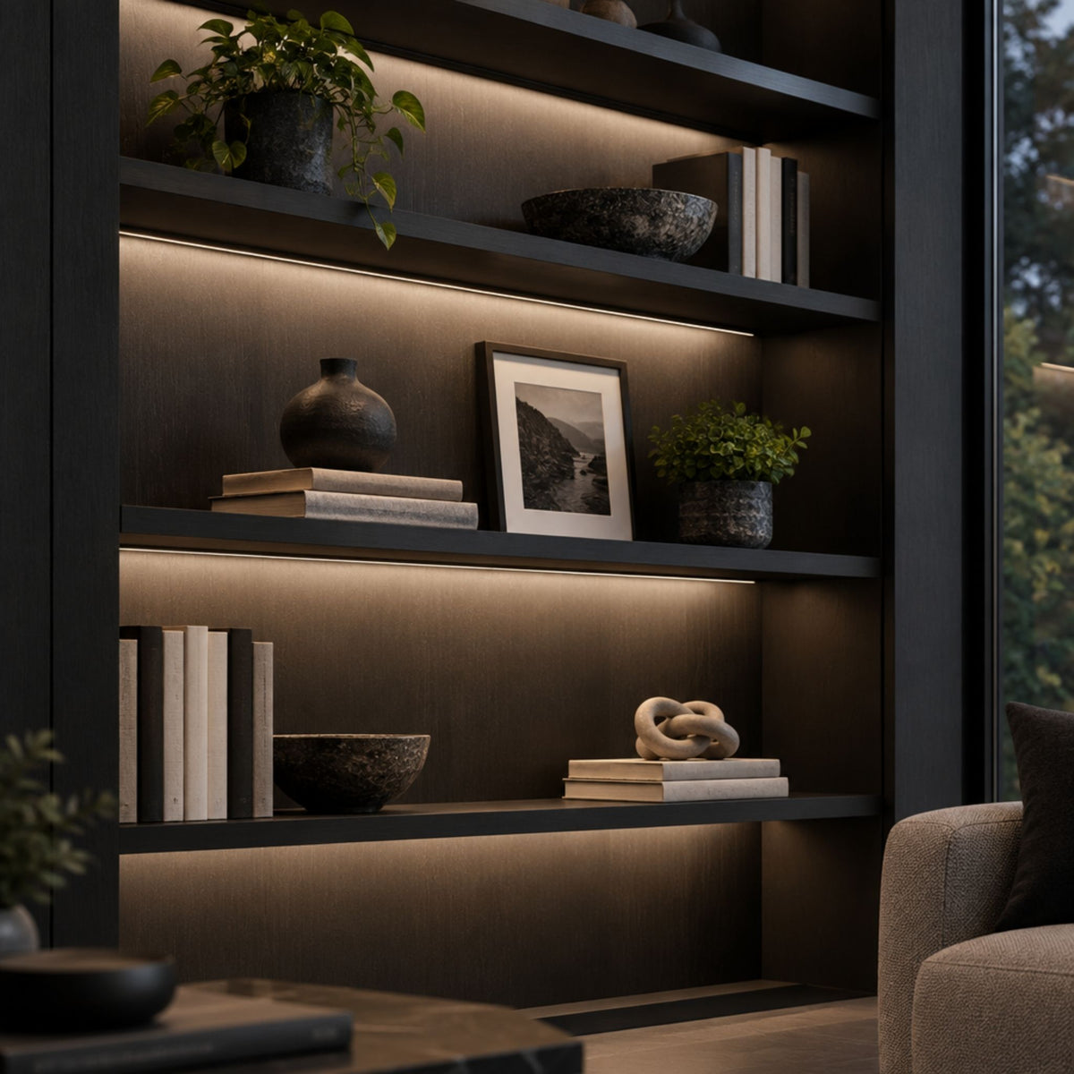 Black mini track lighting channels installed inside shelving