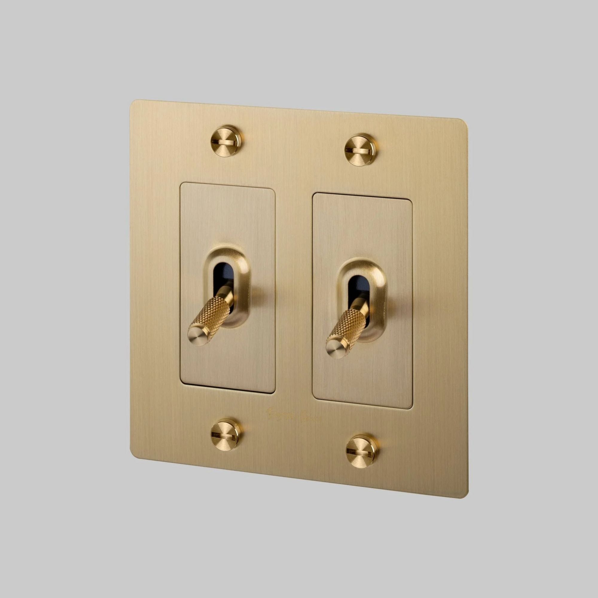 Buster + Punch NTK-053429 Cross 2-Gang Toggle Switch With Logo, 15A, Single Pole/3-Way, Brass