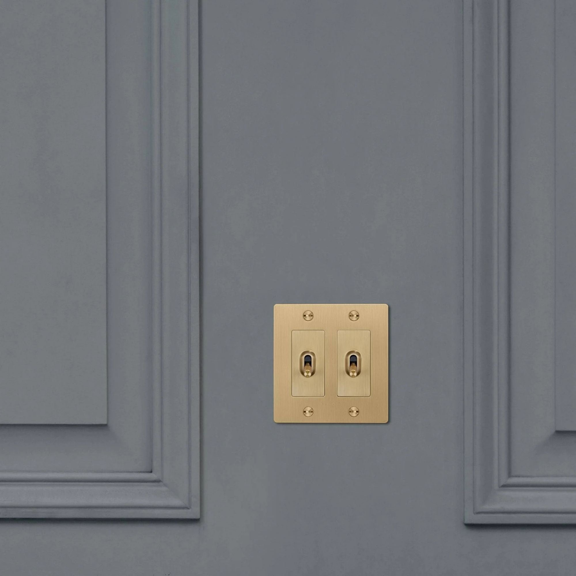 Buster + Punch NTK-053429 Cross 2-Gang Toggle Switch With Logo, 15A, Single Pole/3-Way, Brass