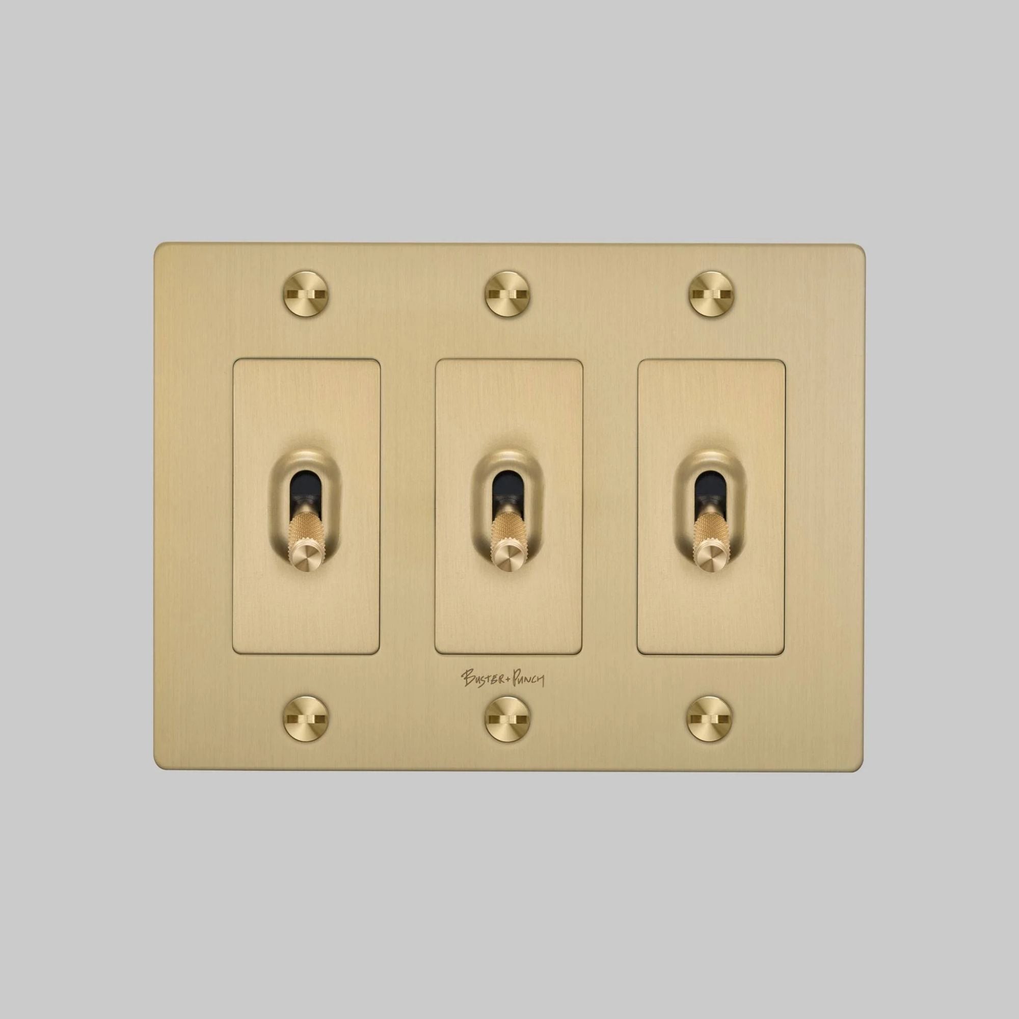 Buster + Punch NTK-054382 Cross 3-Gang Toggle Switch With Logo, 15A, Single Pole/3-Way, Brass