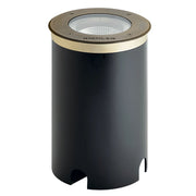 In-ground LED landscape light with centennial brass trim and clear lens, dark body