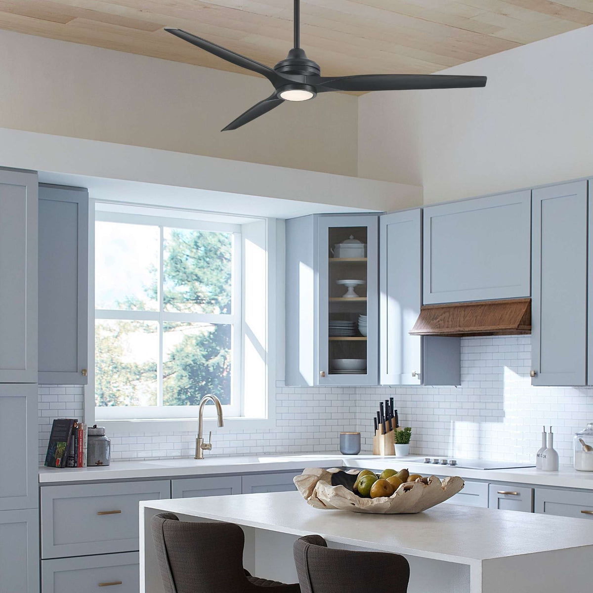 Black ceiling fan motor with five blades mounted on a DC ceiling bracket.