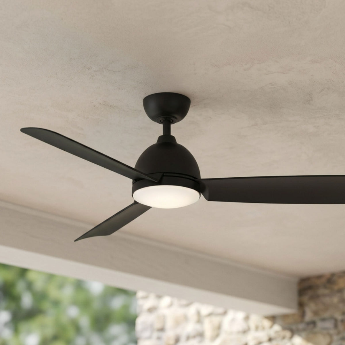 Black marine ceiling fan with LED light and four blades, close-up on ceiling mount