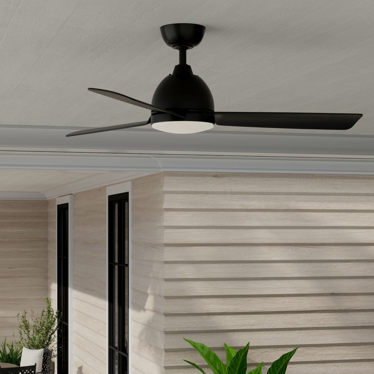 Black outdoor ceiling fan with three blades and frosted LED light on ceiling