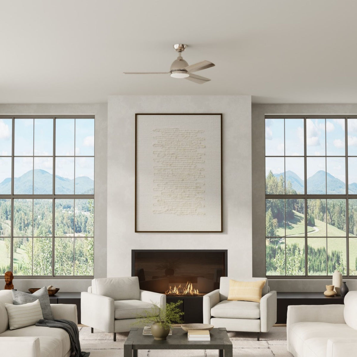 Nickel ceiling fan with four blades and LED light kit mounted on a covered ceiling