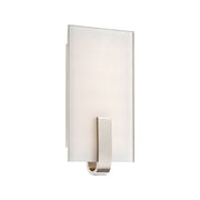 Polished nickel wall sconce with clear glass panel and arched metal bracket
