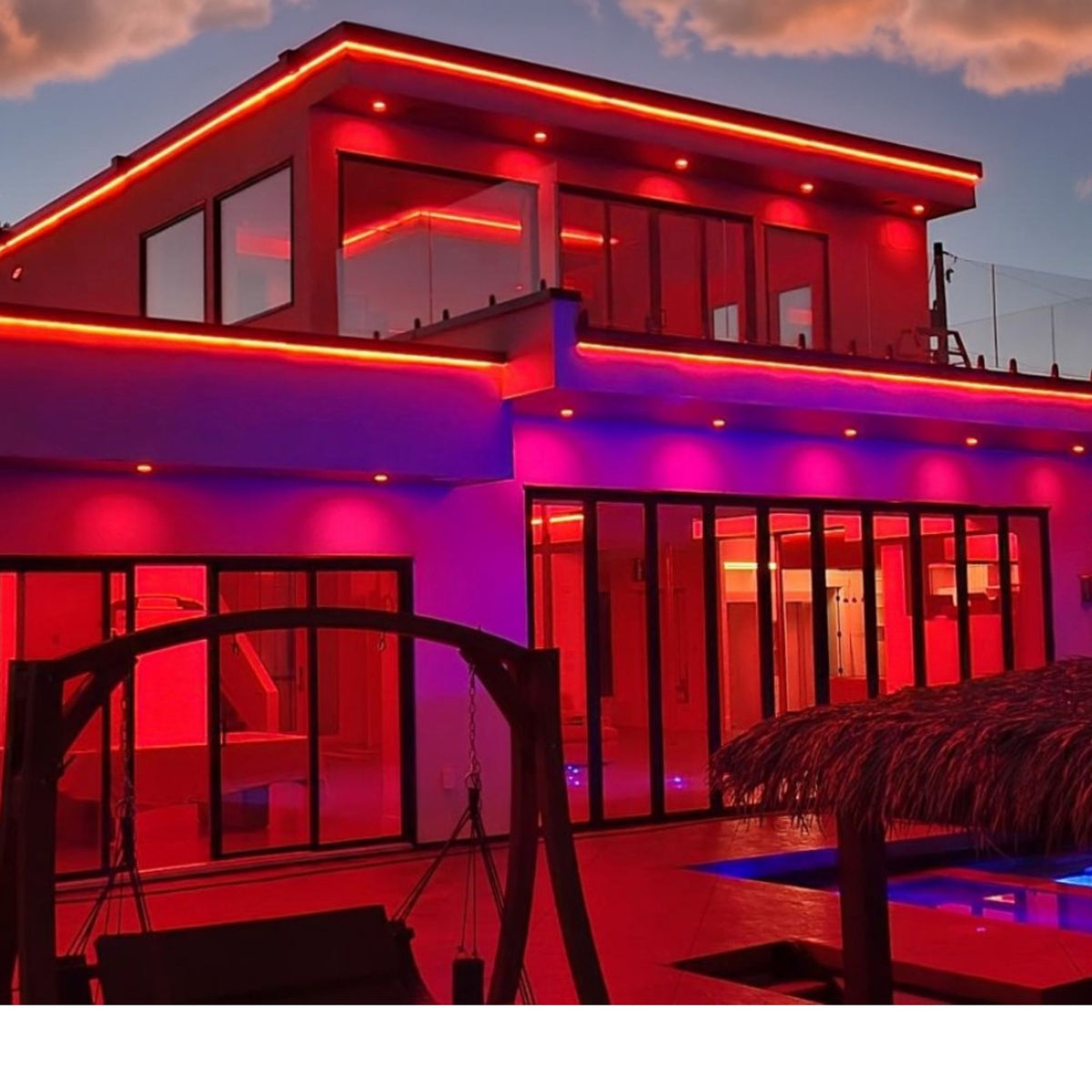 Red neon tape light outlining building edges with continuous glowing trim