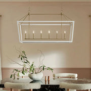 Rectangular clear glass chandelier in champagne bronze with six visible candle-style bulbs