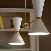 4-light linear chandelier detail with white drum shades and bronze crossbar