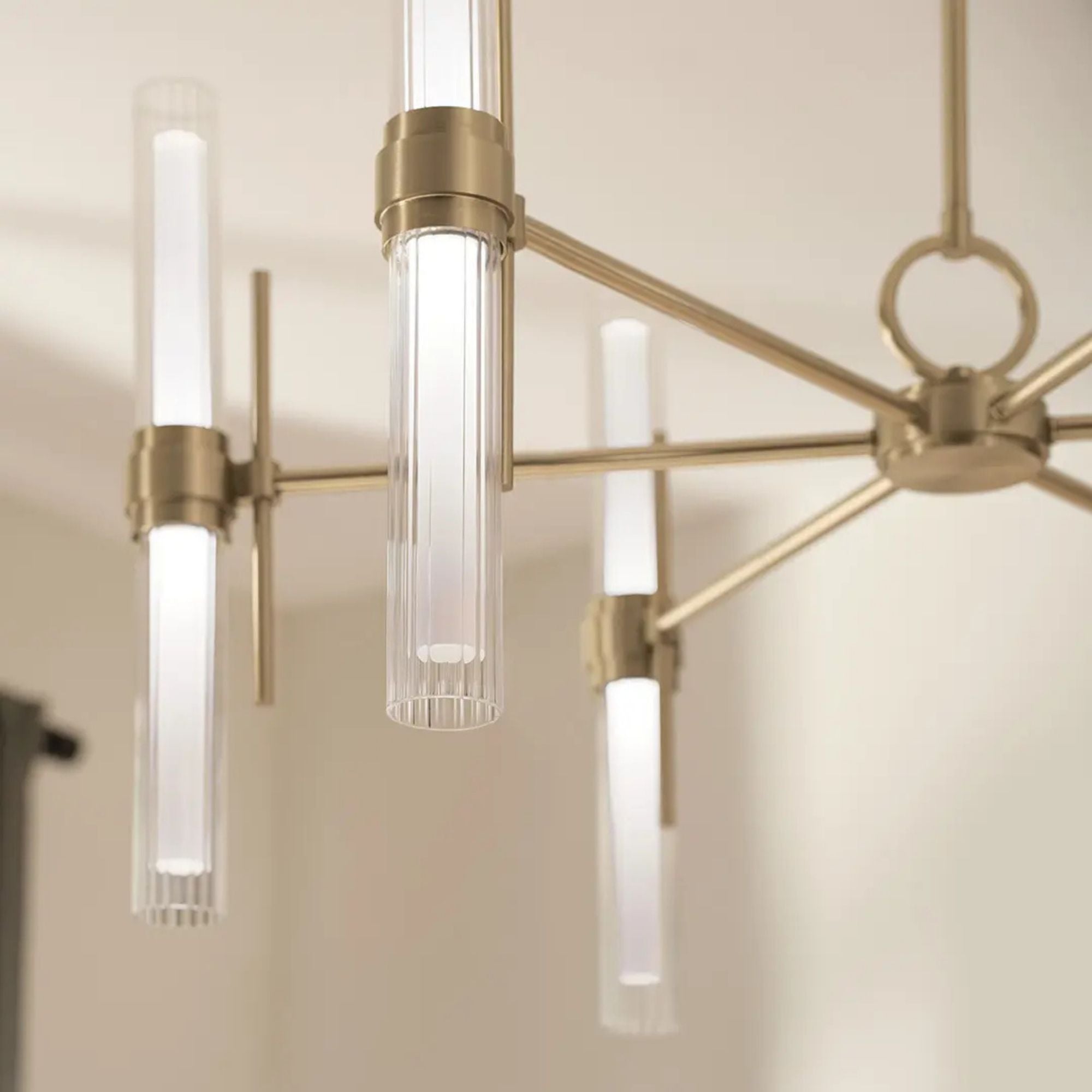 Kichler Riven 33 in. 12-Light Chandelier, Champagne Bronze with Clear Fluted Glass Cylinder Shade