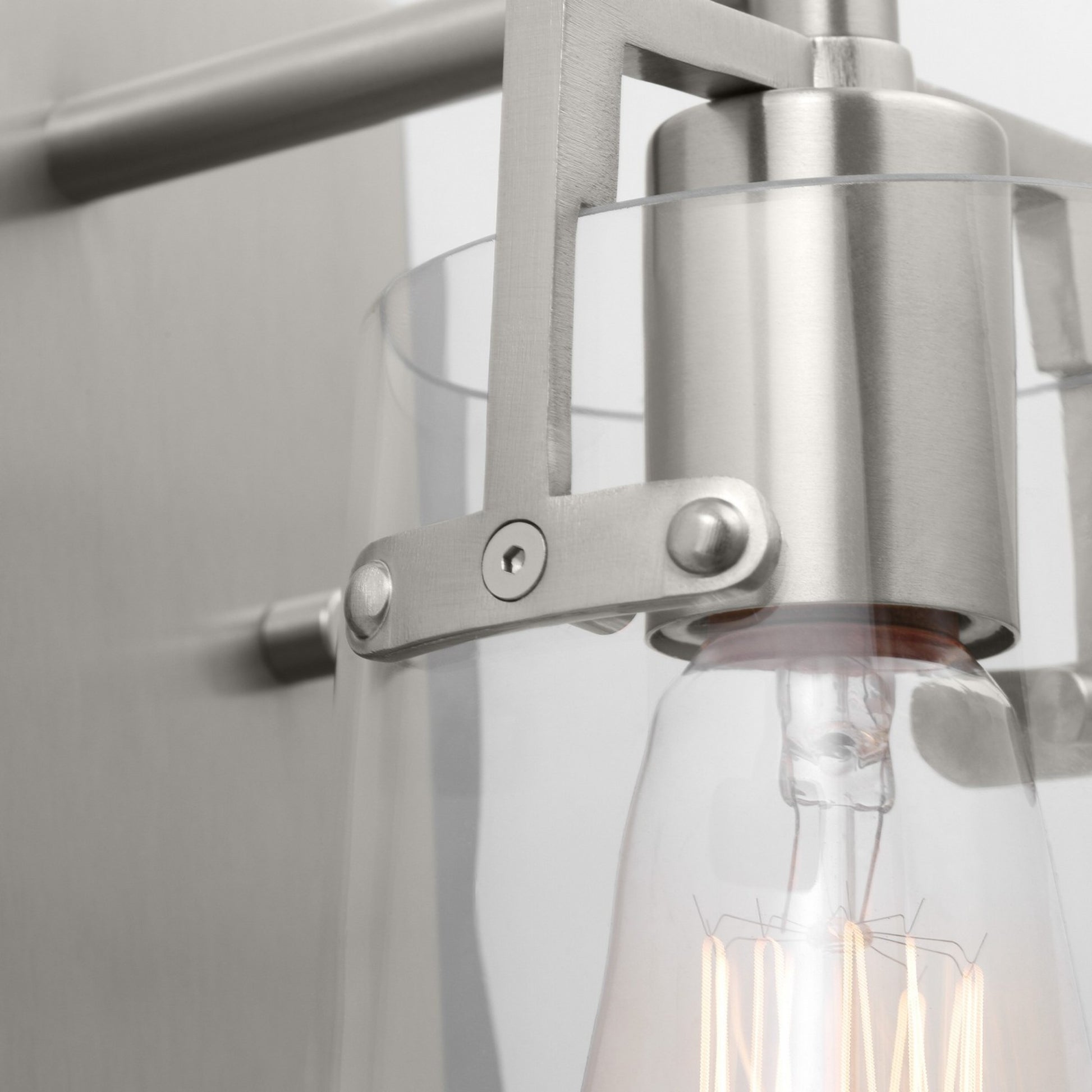 Crofton 9" Bathroom Sconce, Brushed Steel Finish with Clear Glass - Bees Lighting