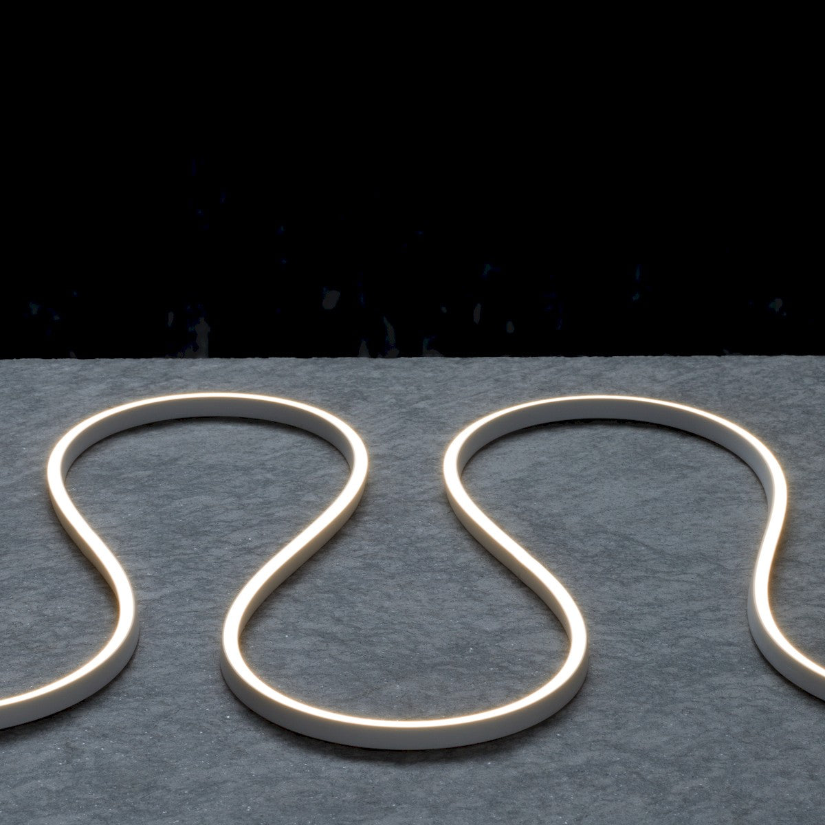 LED neon strip light with soft-white glow forming a heart-like outline curve