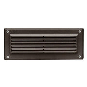 Bronze LED landscape step light with louvered grille in rectangular dark housing