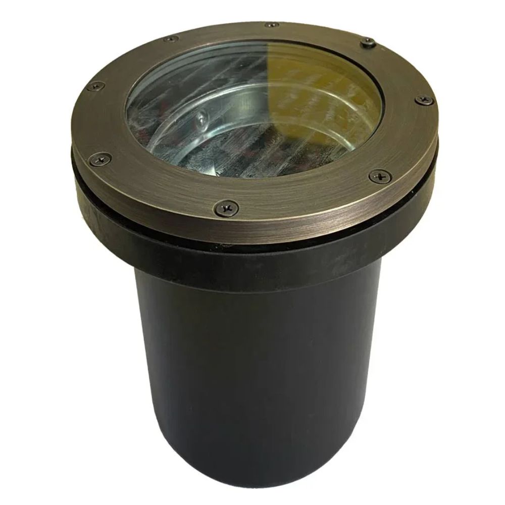 In-ground LED well light with clear glass lens, natural brass ring, and black housing