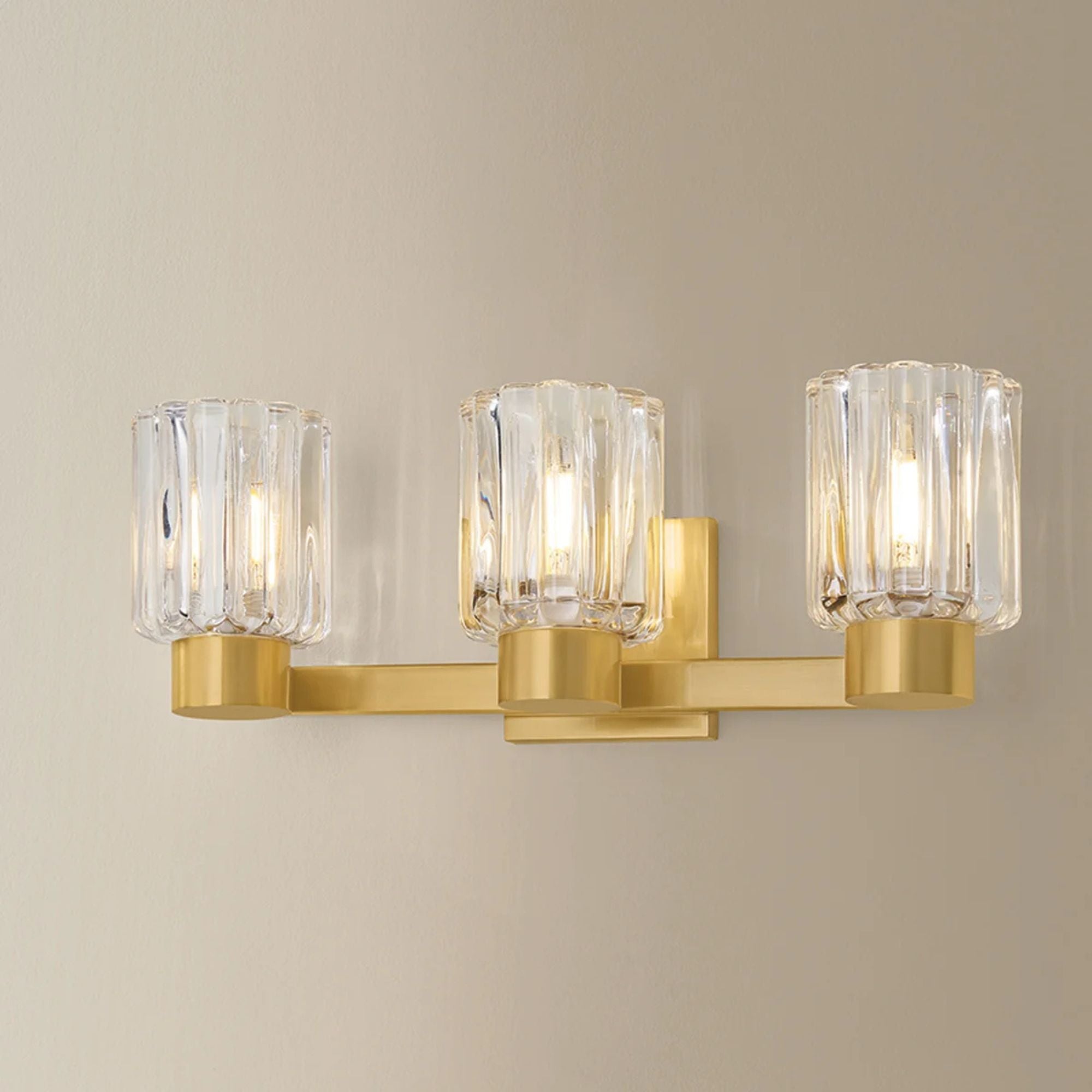 Mitzi Danae 18 in. 3-Light Bathroom Vanity Light, Aged Brass with Clear Optic Glass
