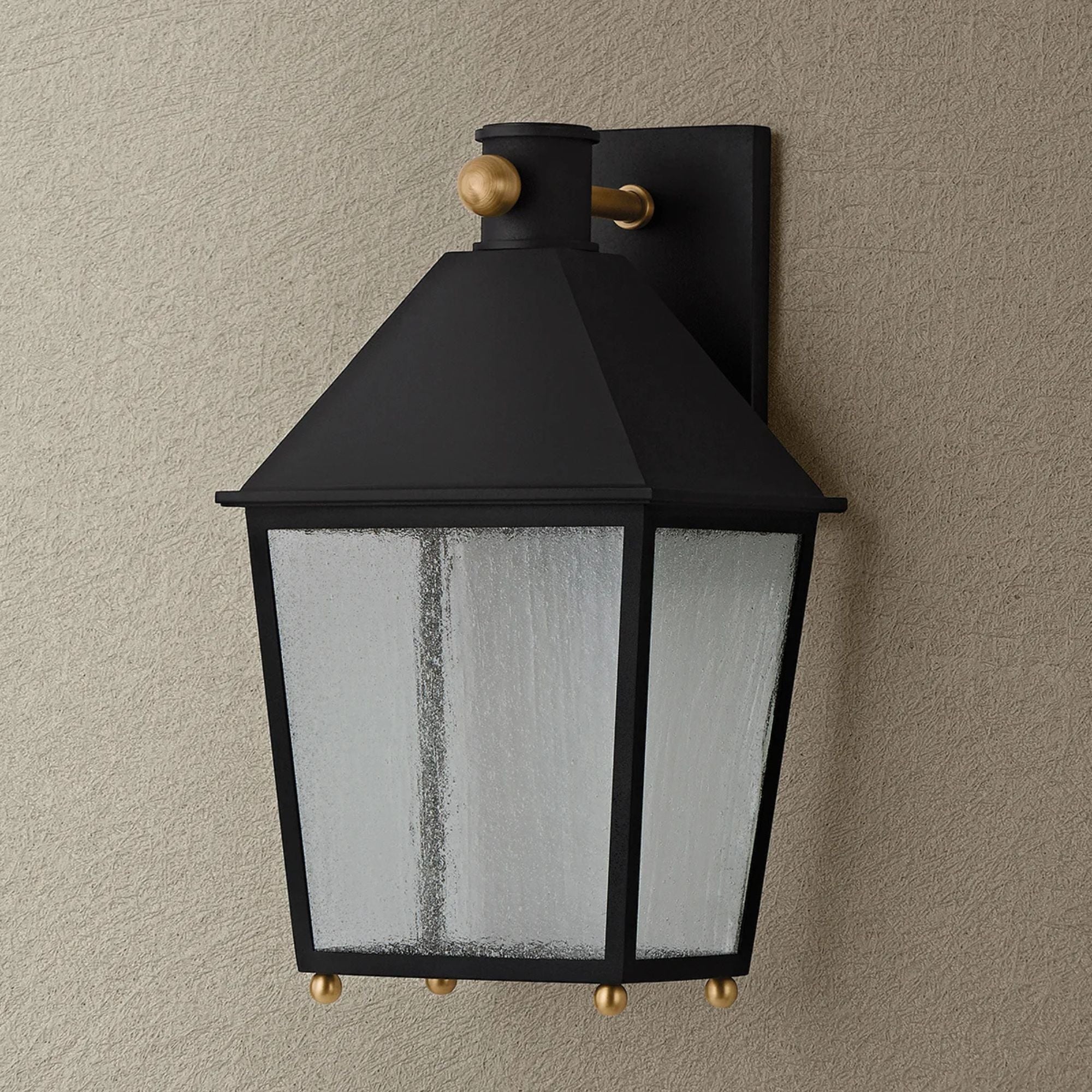 Troy Gladden 15.5 in. Wall Sconce, Texture Black & Patina Brass with Clear Seeded Glass