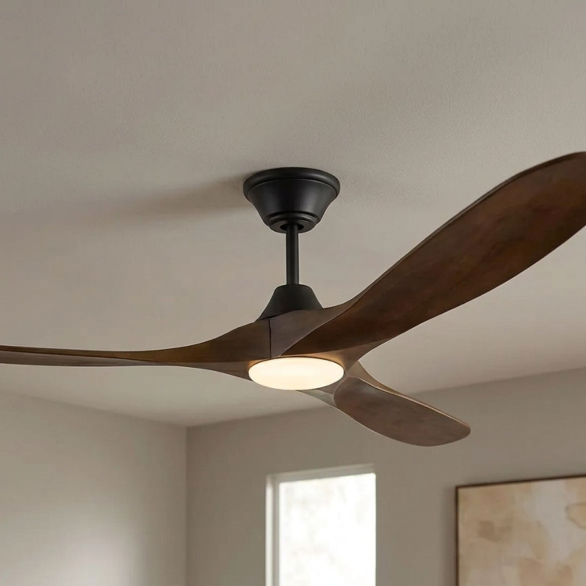 Visual Comfort Maverick Max 70-inch matte black ceiling fan with three dark walnut blades and integrated LED light mounted.