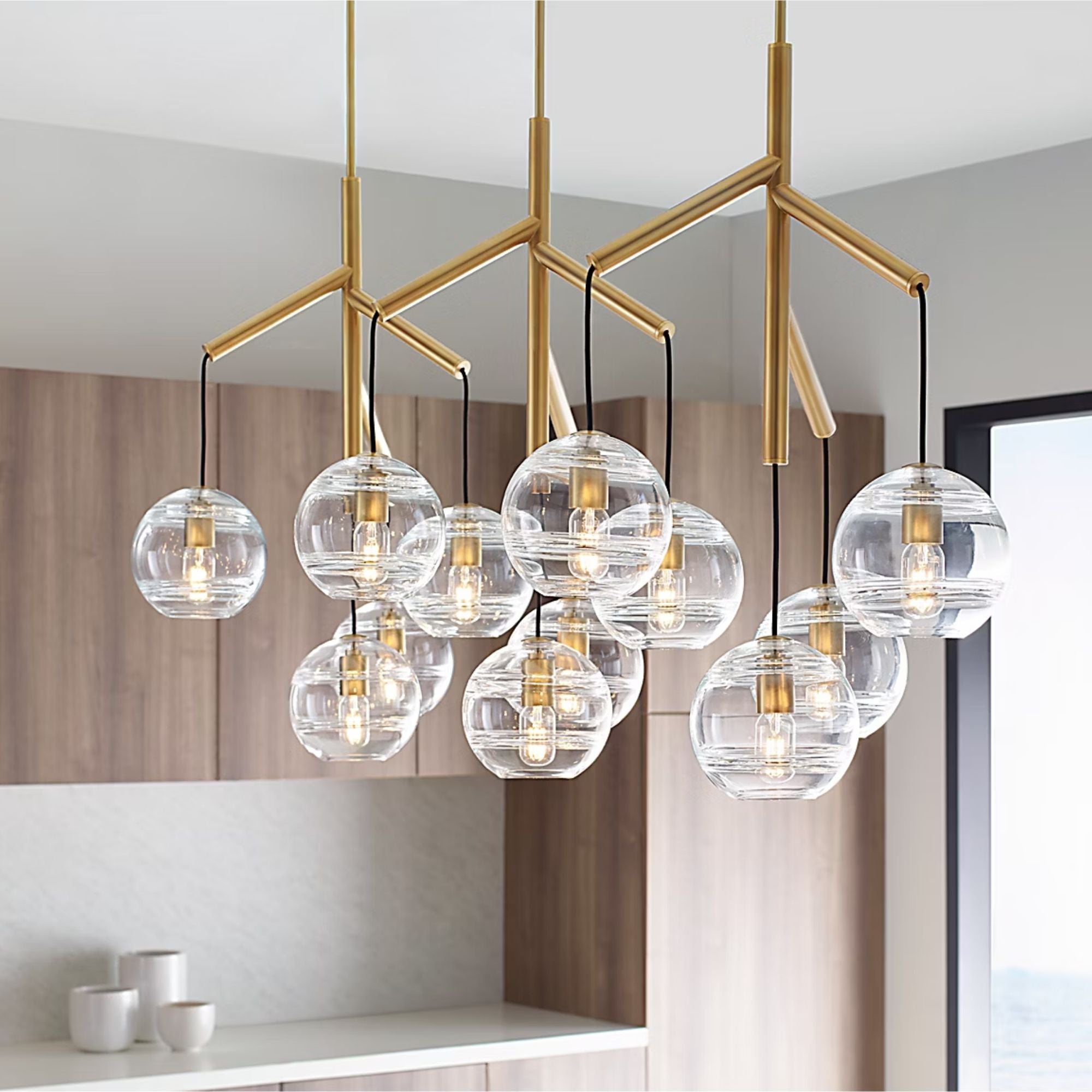 Visual Comfort Modern - Sedona 63" 12-Light LED Triple Chandelier, Aged Brass Finish | Bees Lighting